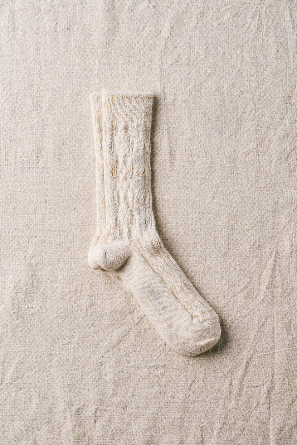 alpaca cable pattern socks in natural