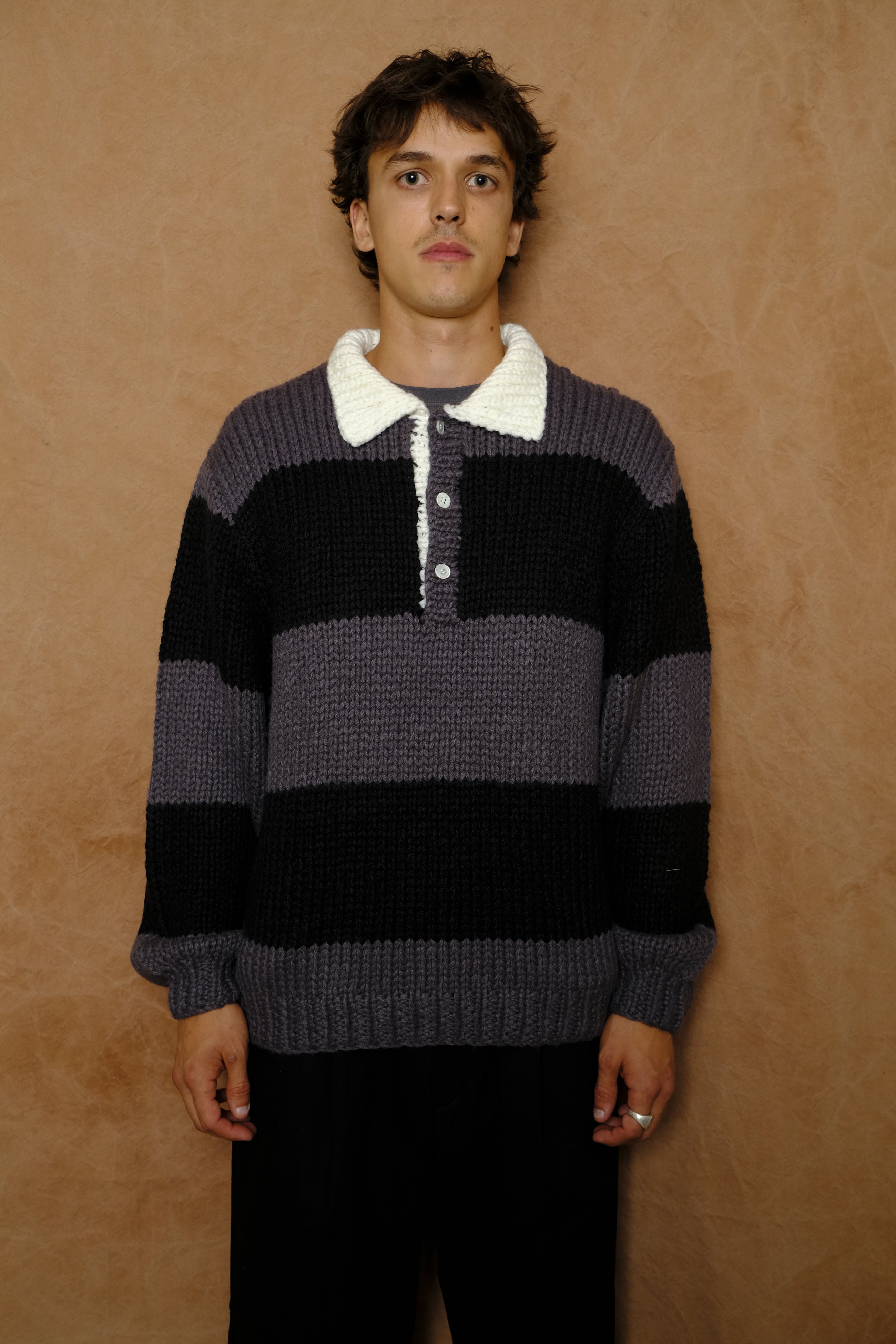 hand knitting rugby in dark gray