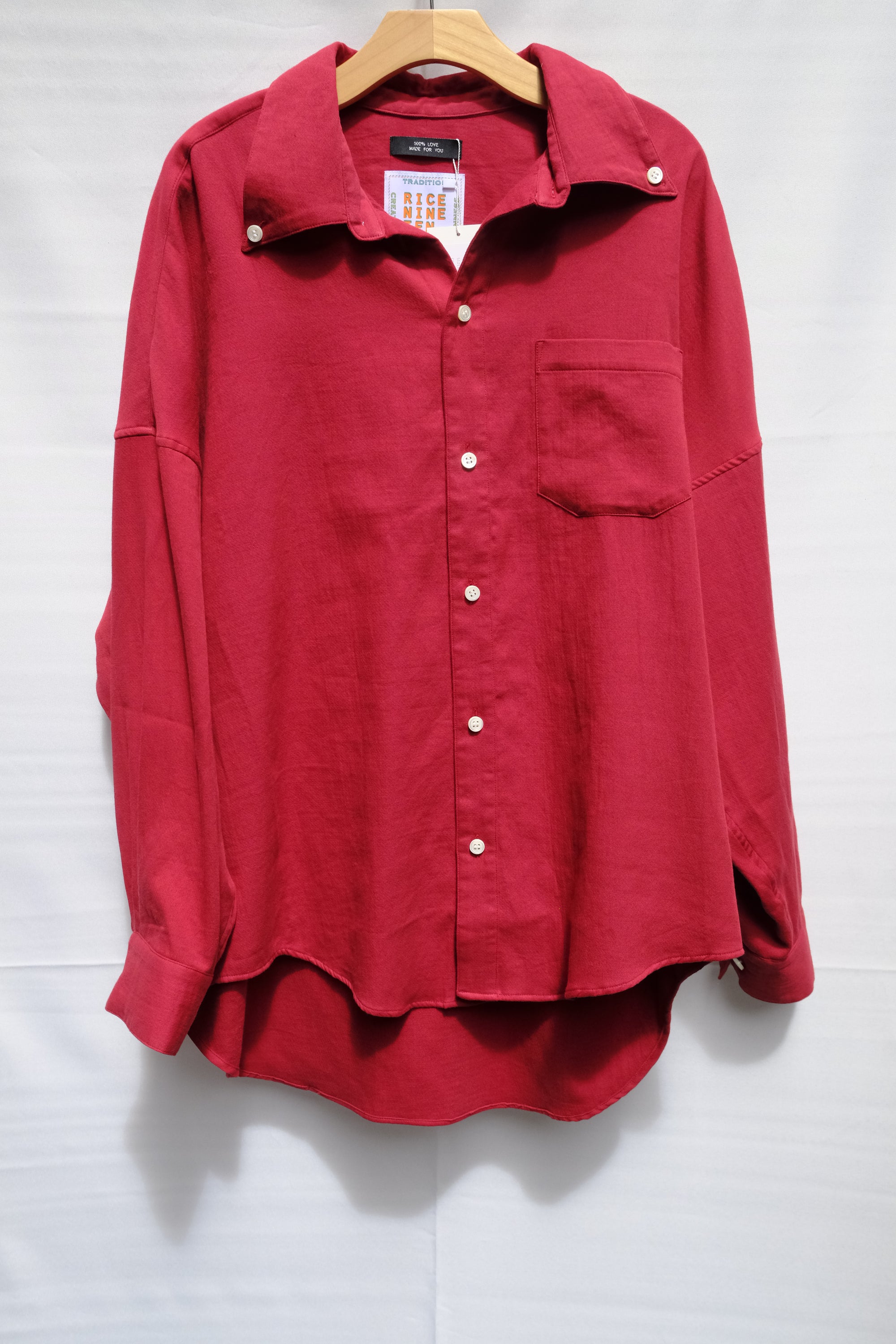 red dropped open button down shirt