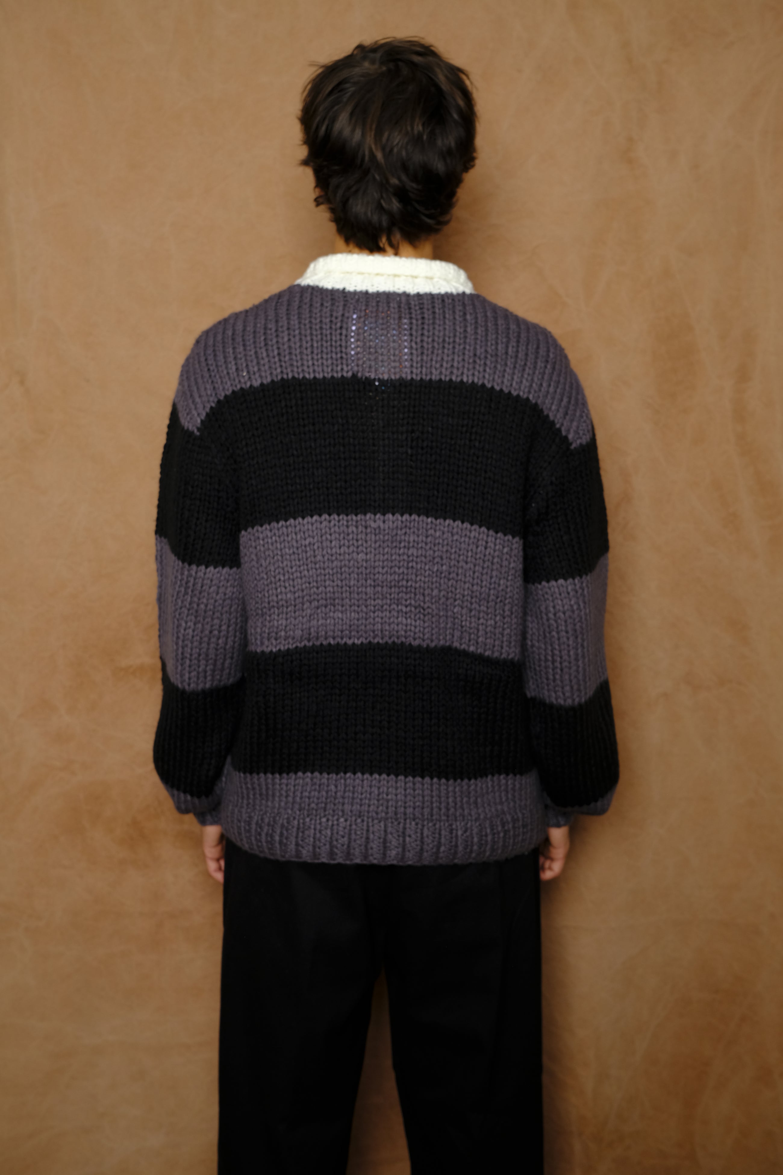 hand knitting rugby in dark gray