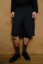 wide shorts in hand loomed black cotton