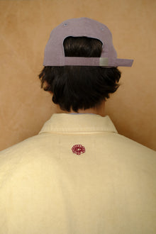 cap in mauve