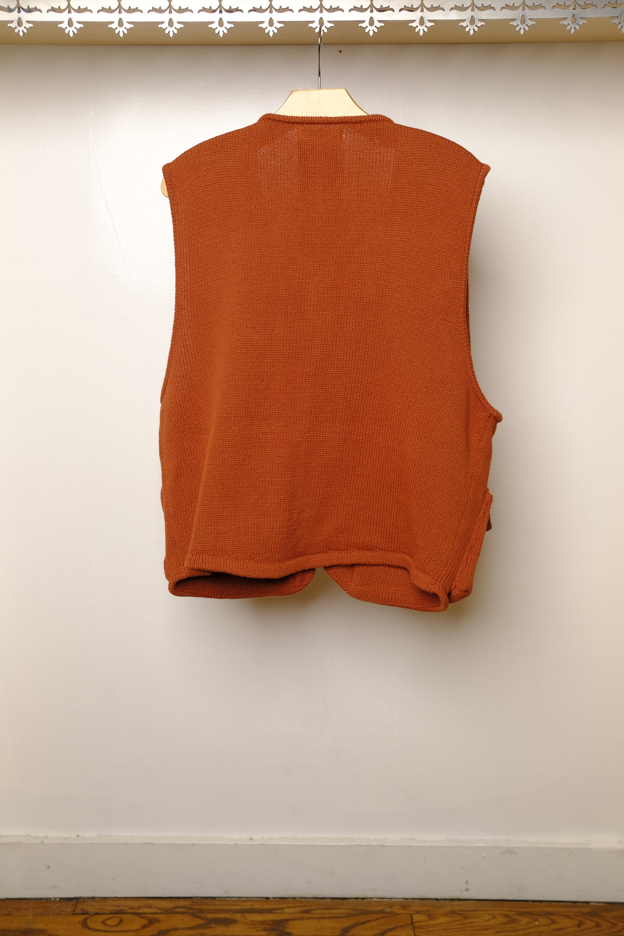 knitted fishing vest in terracotta