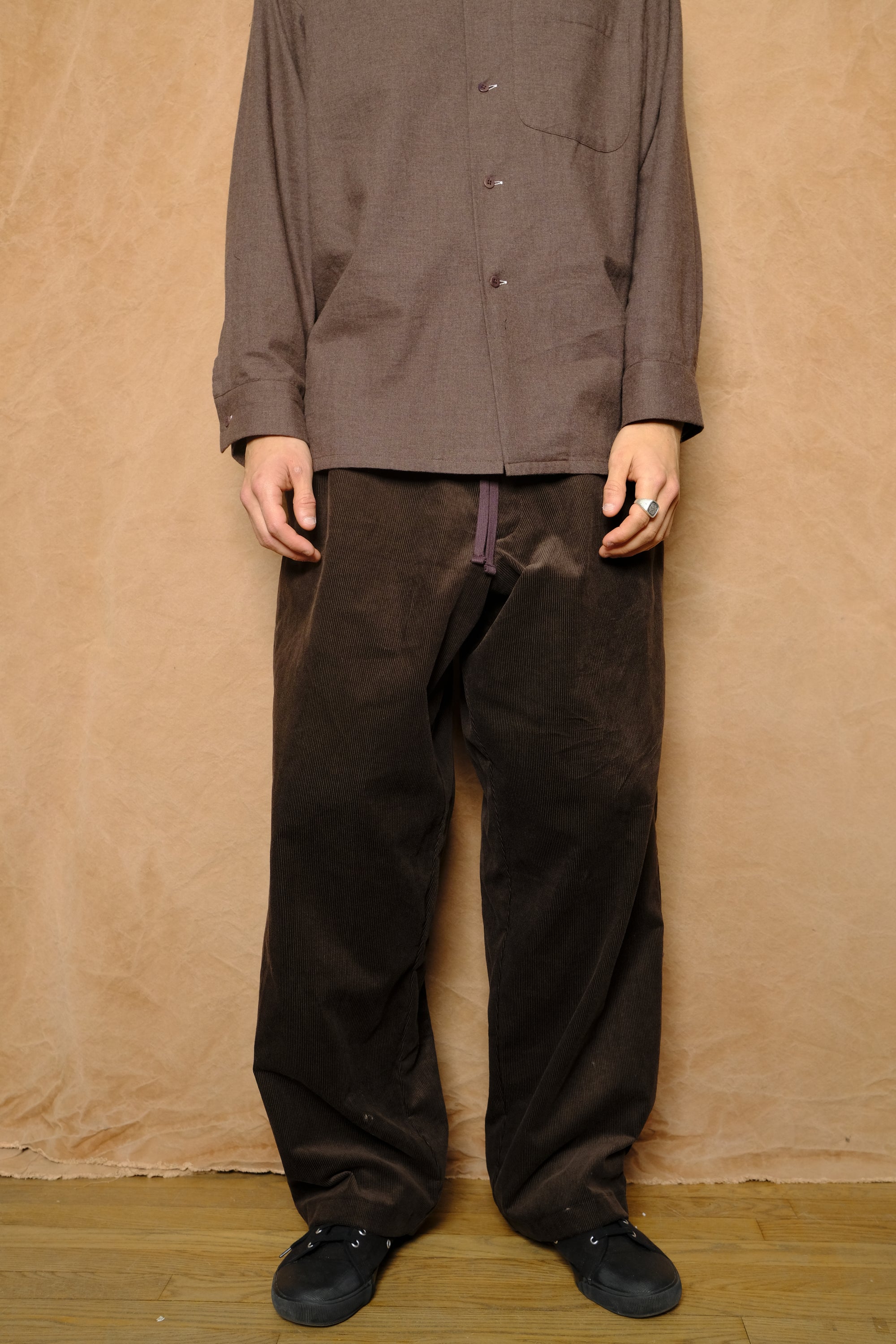 mika in brown corduroy